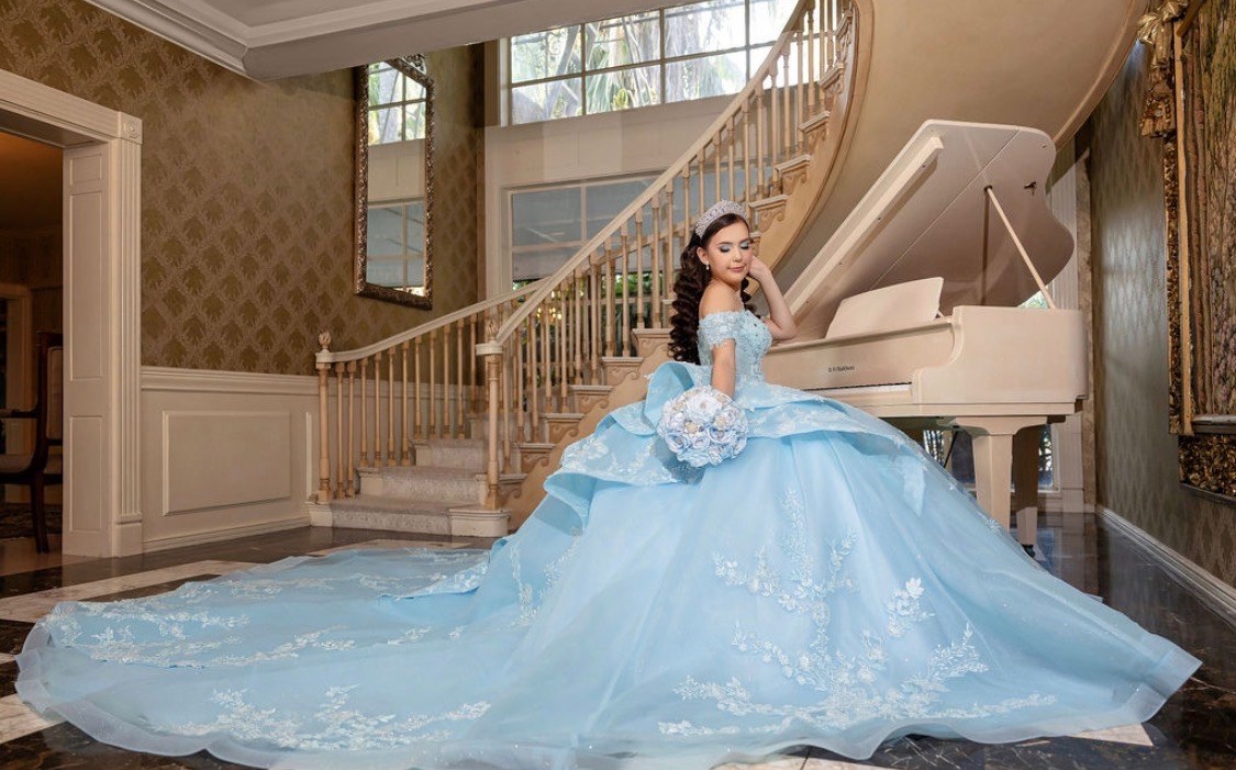 Carolina Barrientos Pruneda in her baby blue quinceanera ball gown
