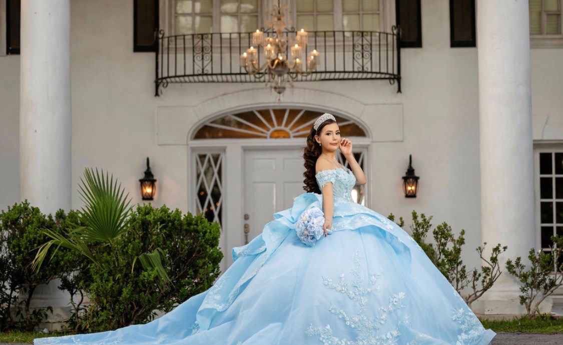 Carolina with the full train of her baby blue gown spread out